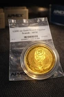 1/200 oz Gold Round – Egyptian Scarab Design – APMEX PackagingOffered here is