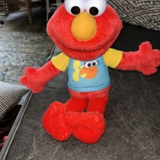 SESAME STREET 13-inch Sing-Along Plush Elmo with Lights and Sounds Works