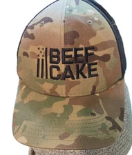The Classics Yupoong Snapback Trucker Hat Camo BEEFCAKE One Size Mesh Back 