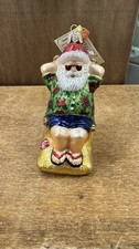 OLD WORLD CHRISTMAS SUNNING SANTA SUN TANNING GLASS CHRISTMAS ORNAMENT 40295