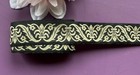 Jacquard Ribbon, 1+3/16 inch wide Black - old gold selling by the yard