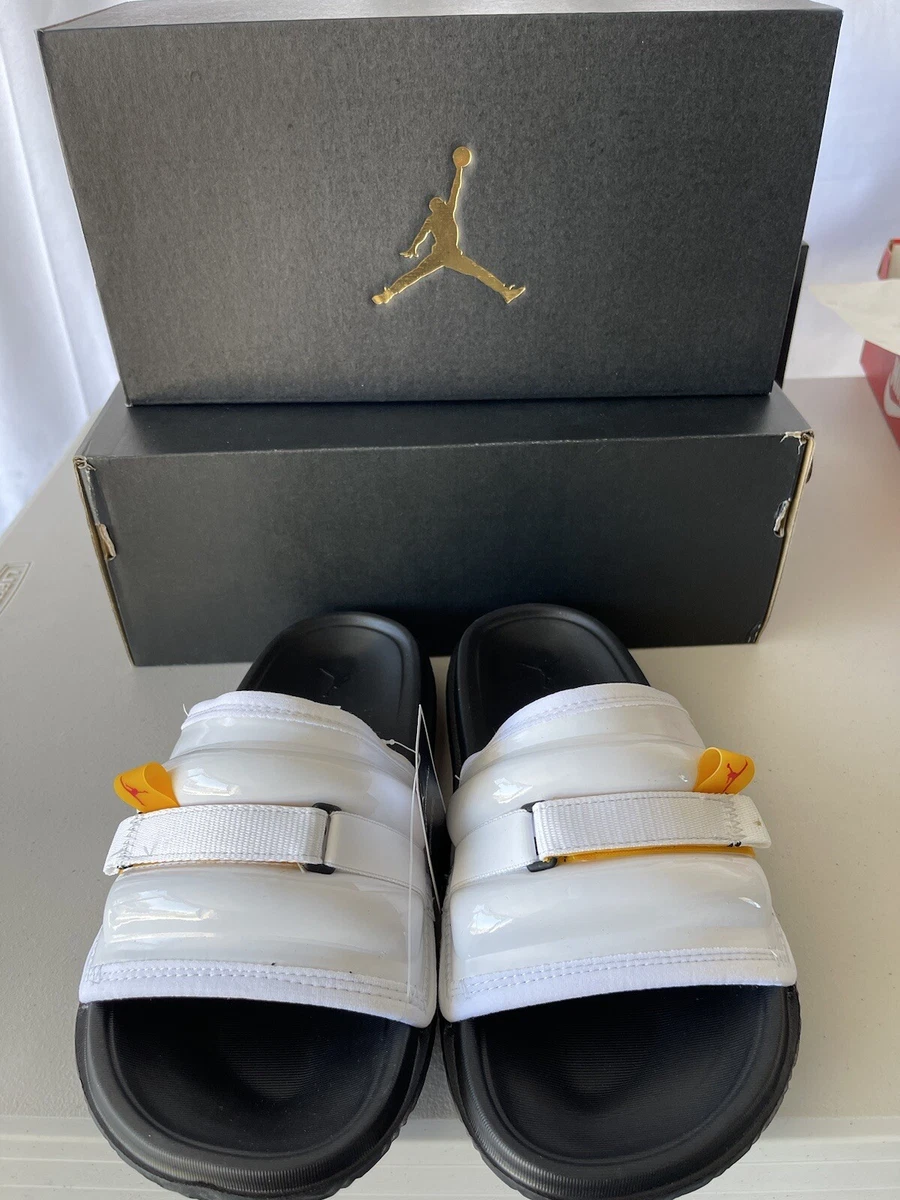 Jordan slides hot sale black and gold