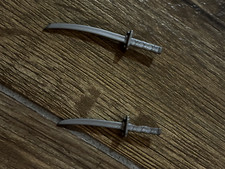 a pair of ninja sword for 10 inch ninja figures
