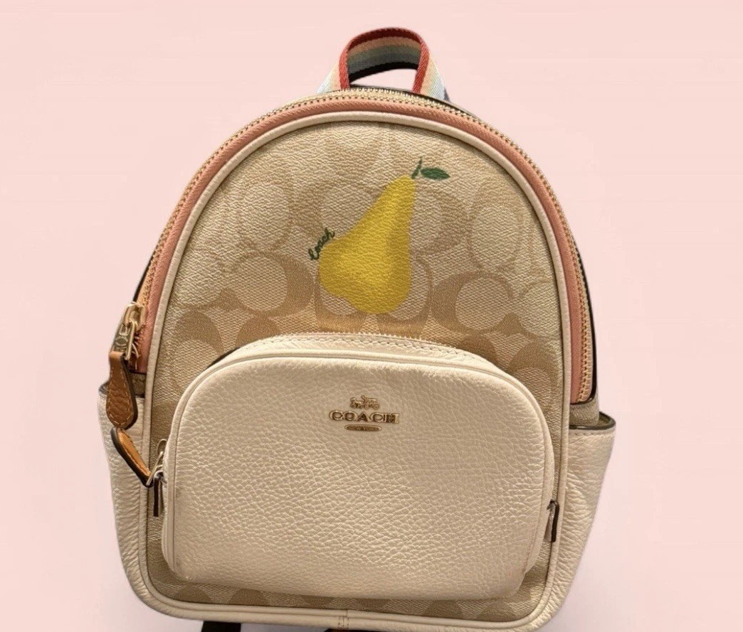 Pre-Owned Coach Mini Court Backpack in Signature Canvas with Pear Charm