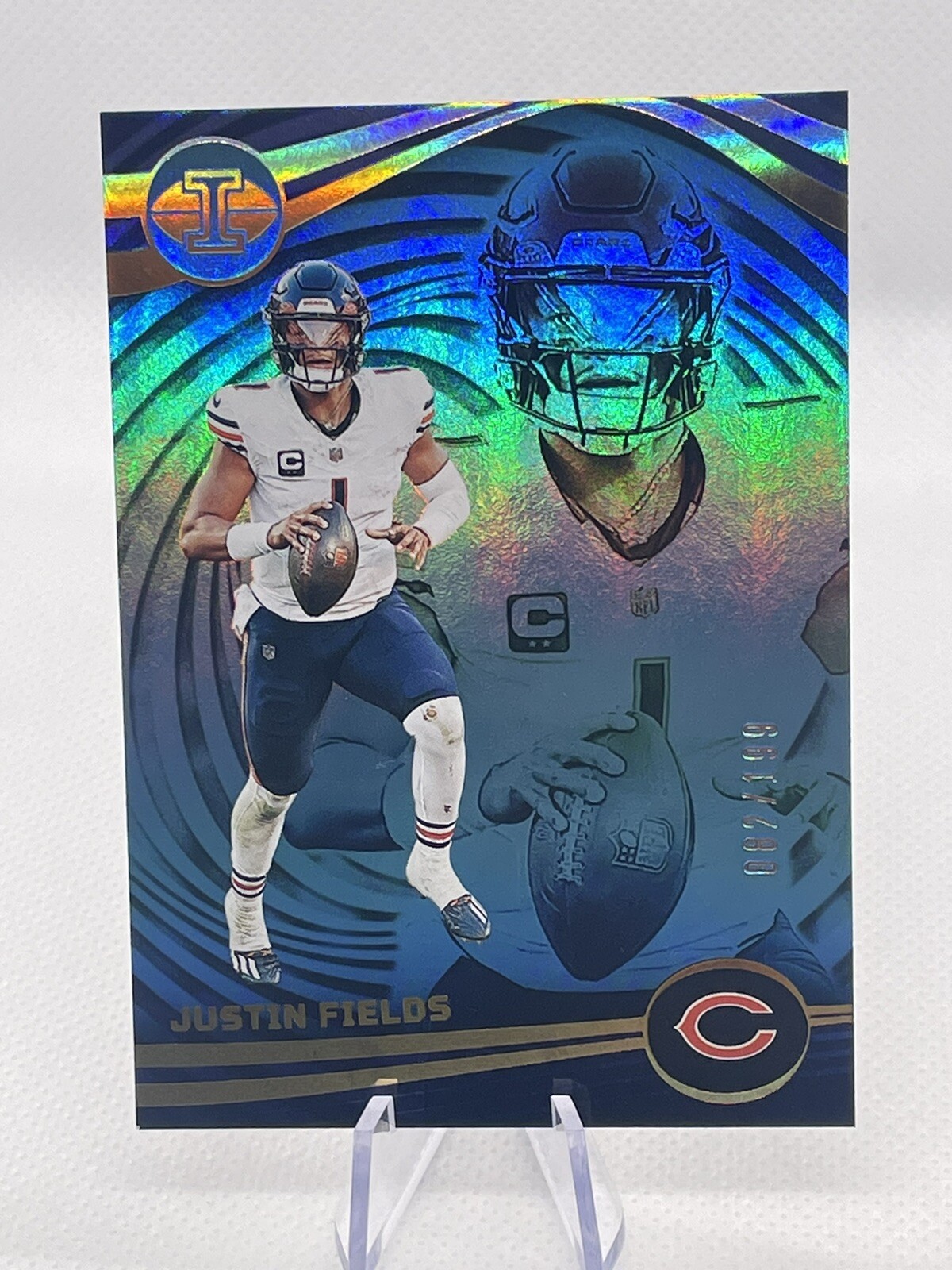 2023 Panini Illusions Justin Fields Blue Trophy Collection 82/199 Bears #17