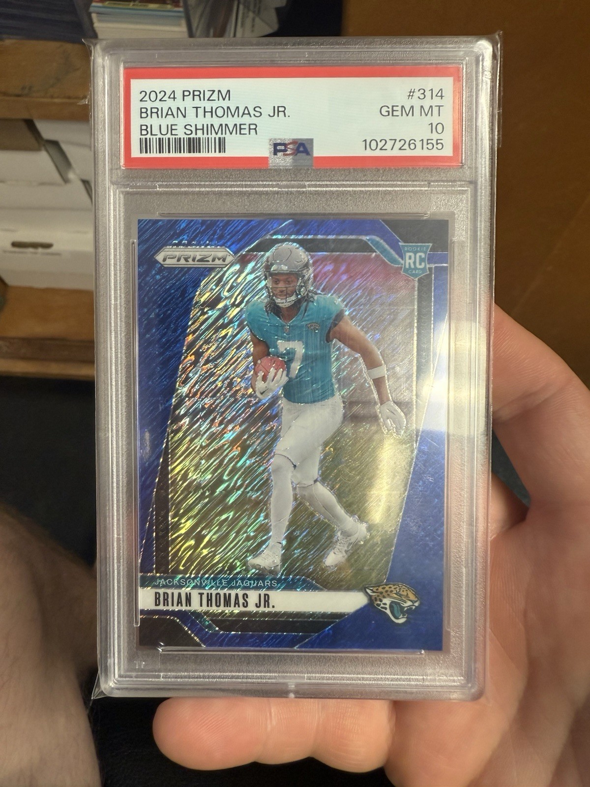 2024 Panini Prizm #314 Brian Thomas Jr. Blue Shimmer RC #08/25 PSA 10 pop 3