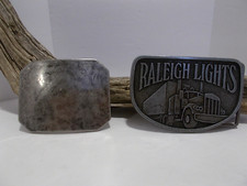 2 Vtg Belt Buckles - Raleigh Lights Belt Buckle Semi-Truck  Marbled Silver Tone