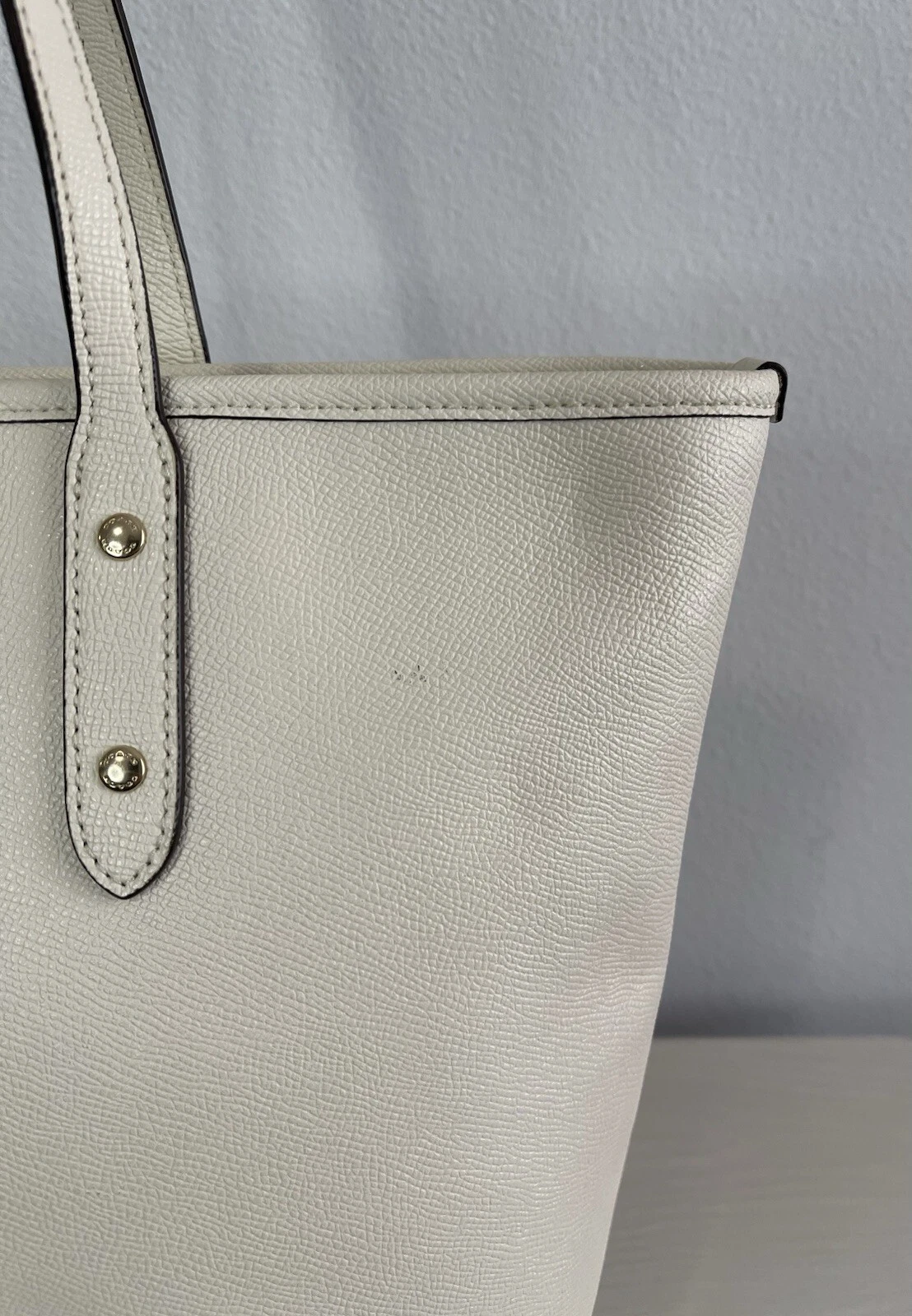 Borsa Coach City con zip e rivetti in cristallo polvere di stelle