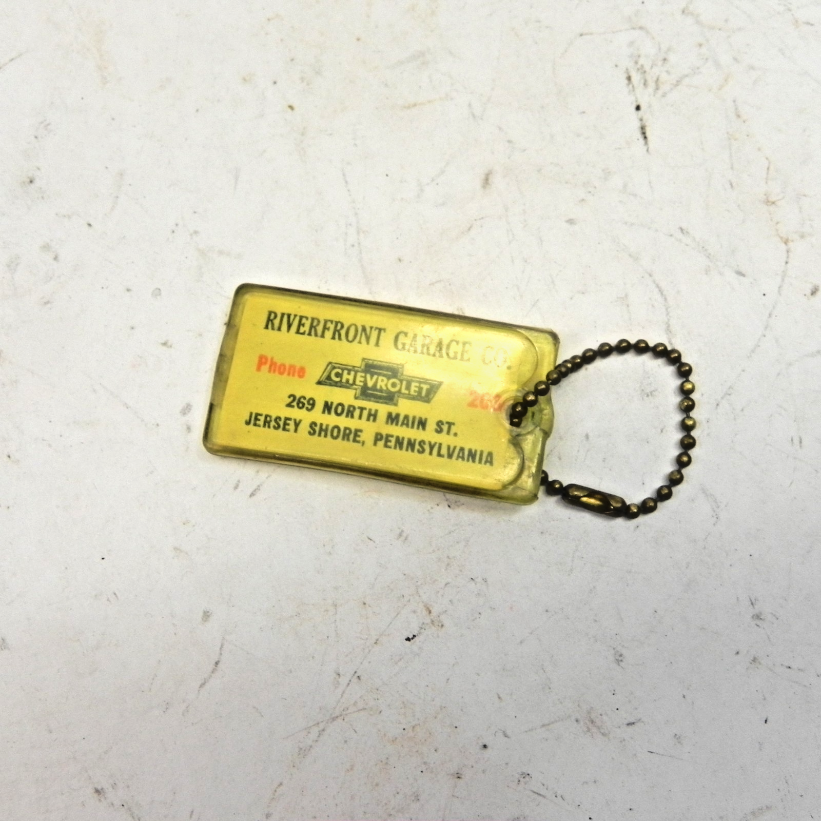 VINTAGE RIVERFRONT GARAGE CO CHEVROLET DEALERSHIP KEYCHAIN JERSEY SHORE, PA USED