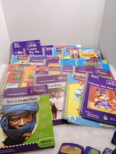 lot of 22 LeapFrog SchoolHouse learning books with accompanying cartridges.