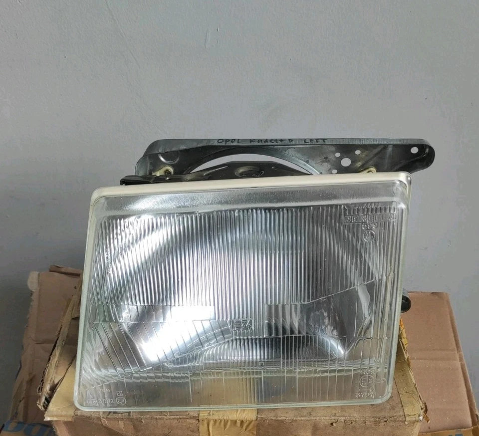 Faro Opel Kadett D LH NOS Original Carello GM Foto 2 de 4