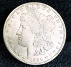 1884 S Morgan Dollar UNC Great Eye Appeal Excellent Strike. 100% Original White