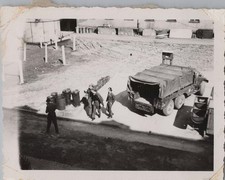 WW2 Photo of Army Cargo Truck Parked Beside Barracks Yard With 4 Men