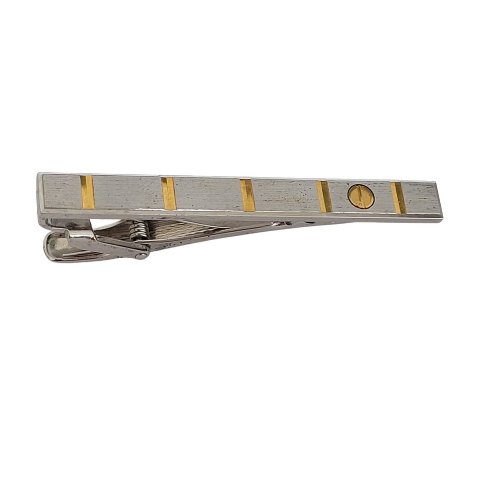 A sleek two-tone Dunhill tie clip with a distinctive screw motif — understated British luxury that most men have never seen before.