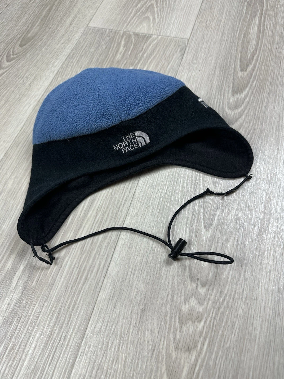 The North Face Gore Wind Stopper Black/Blue Fleece Hat with Ear Flaps. Size M