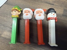Collection of vintage-style Christmas-themed Pez dispensers