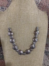 Beautiful silver tone round discs with silver tone spacers on silvertone chain 