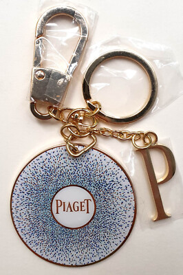 PIAGET Schlüssel- bzw. Taschenanhänger Key Chain Charm, Metall emailliert, NEU!
