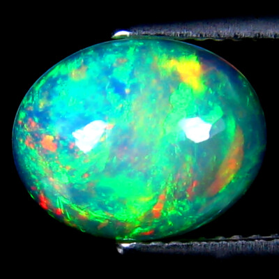 2.22 ct Outstanding Oval Cabochon (12 x 9 mm) Ethiopia Play of s Rainbow Opal