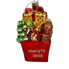 Macy’s Holiday Lane 2013 Glass Ornament – Red Shopping Bag w/ Gifts & Teddy Bear