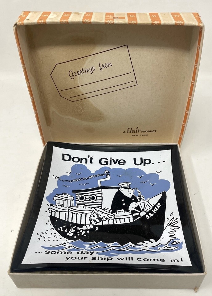 Smoked glass trinket tray with deadpan 'Don't Give Up' message — retro desk humor you can actually use.