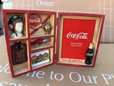 Coca-Cola themed picture frame and shadow box combination
