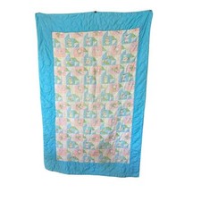 Vintage pastel quilted baby blanket with nursery decor