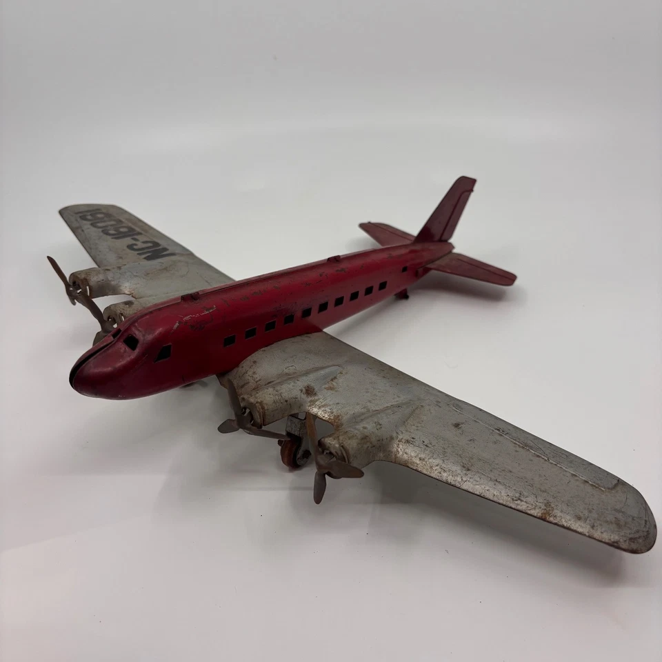 Vintage Wyandotte Pressed Steel Airplane Toy 4-Engine Airliner Red & Silver NC-1 - Image 2 of 4