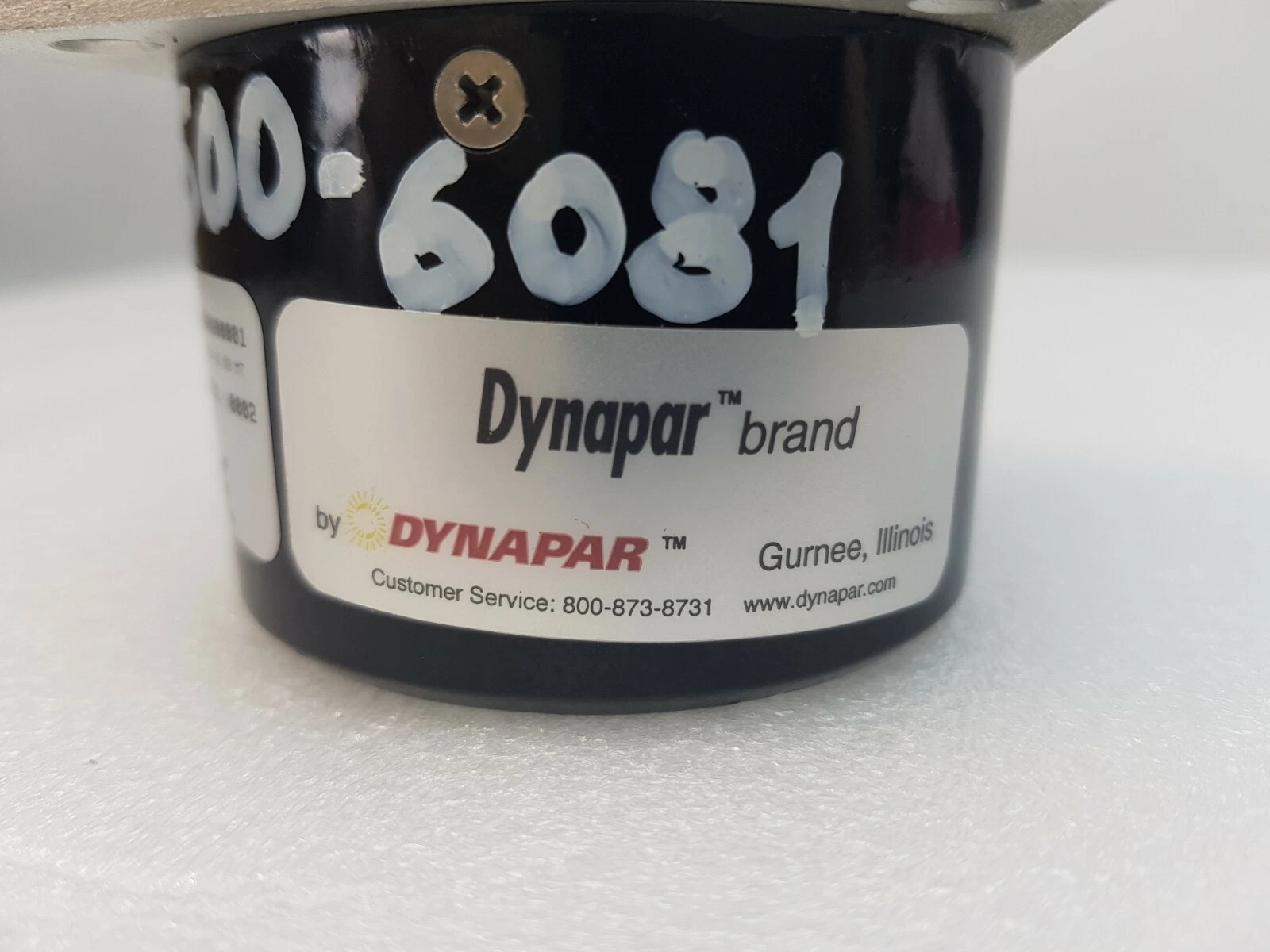 Dynapar brand label on the HR525 encoder body with handwritten marker number