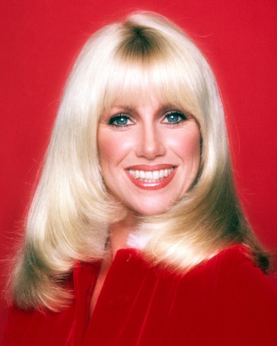 suzanne somers stunning smile red dress against backdrop 8x10