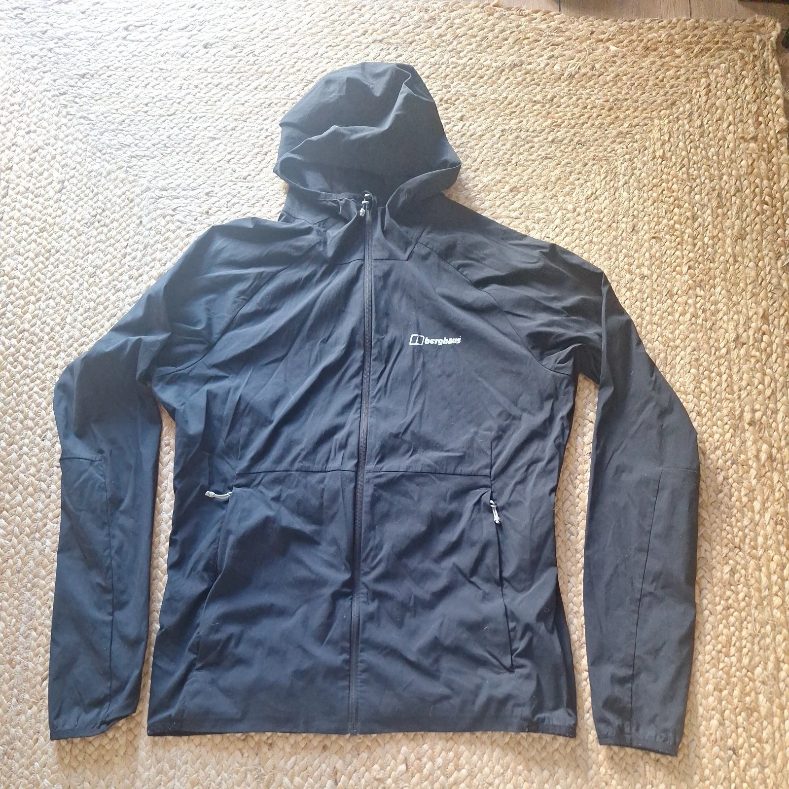 Berghaus light jacket hooded windbreaker size medium full zip pockets black logo
Opens in a new wind