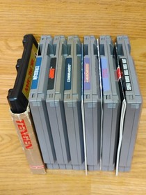 NES Lot Of 7 Games & Game Genie - Beetle Juice, Mario Duck Hunt, Jaws, Tetris 