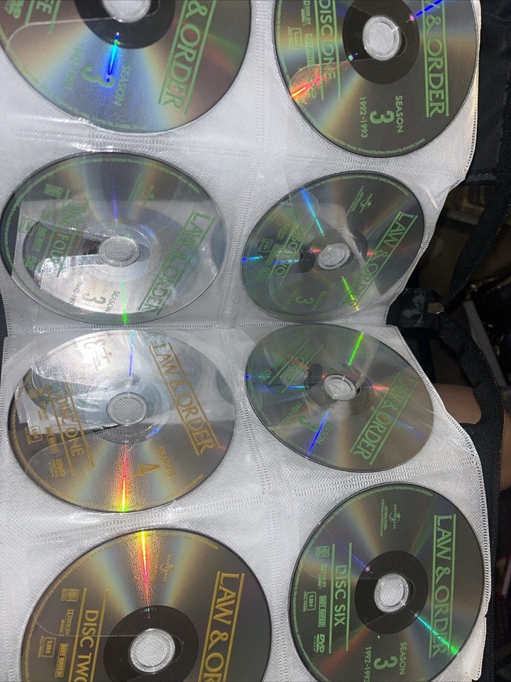 Binder of DVDs Classic TV shows and Crime Law & Order, The Equalizer