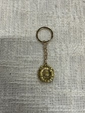 Gold Toned Keychain With Opening Sunflower Pendent