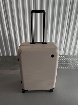 MONOS Hard Shell Checked Bag Pockets Rolling Travel Luggage Suitcase - 26 Inch