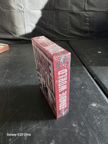 Red Zombie World RPG box set with white side, black cover, and bold red title text.
