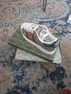 Dark green heel detailing adds contrast and complements the stripe accents,...