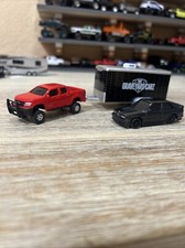 Custom 2015 Chevy Colorado e Custom 1988 BMW M3 con rimorchio