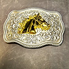 1536. Belt Buckle Gold Tone Horse Head on Silver Tone Background