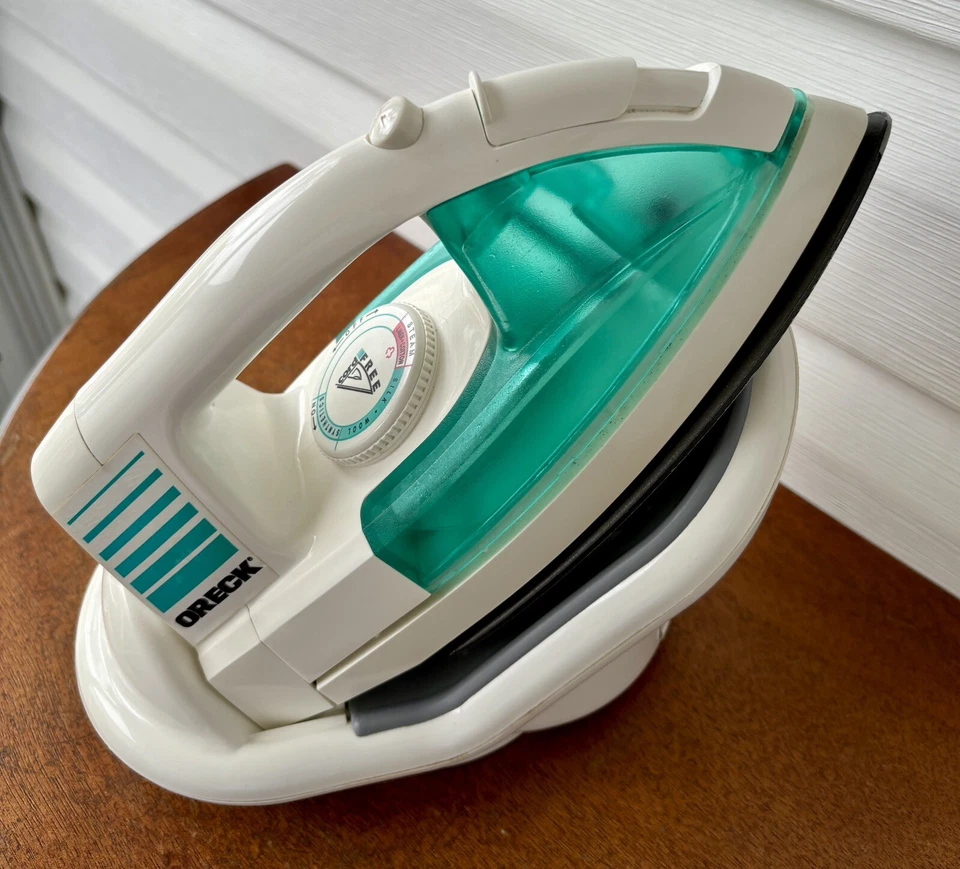Plancha de vapor Oreck sin cable modelo TX850 base de alimentación giratoria con cable de almacenamiento Foto 2 de 4