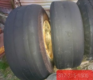 46 X 16 ON TEN HOLE WHEEL TIRE IS RATED TO 40000 POUNDS 200 MPH