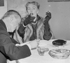 Making Her Point Her escort appears shy in West side restaurant as .. Old Photo