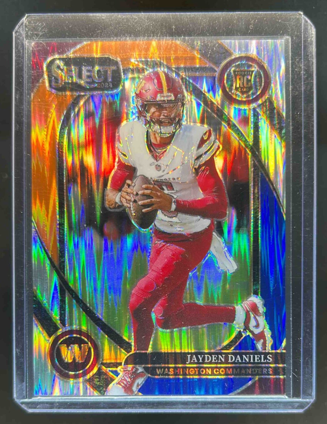 2024 Select Jayden Daniels Club RC Blue and Orange Prizm Shock #32/35 Commanders