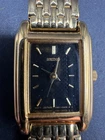 Vintage Seiko 1N01-0CR0 Women's Gold Plate Tank Quartz Watch Black Dial