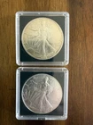 2 American Silver Eagle Coins 1990 & 1999 in plastic cases - 1 oz silver each