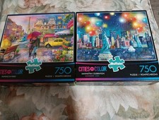 2-Buffalo Cities In Color 750 Pc Puzzles  RAINING IN PARIS  -NEW  MANHATTAN.....