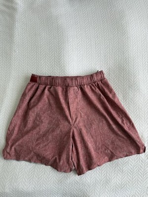 Lululemon Pace Breaker men's athletic shorts in a red brick color. 