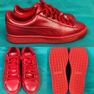 red leather puma sneakers