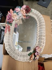Vintage wicker mirror with floral embellishme...