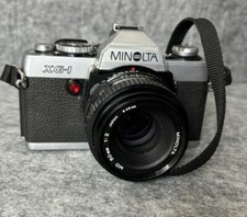 Minolta XG-M Camera w/ 50mm Lens Used In Good Physical Condition UNTESTED